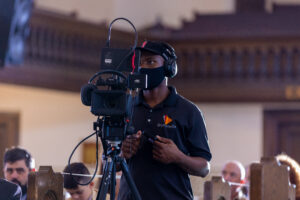 Cedric M. live-streaming a church wedding ceremony.